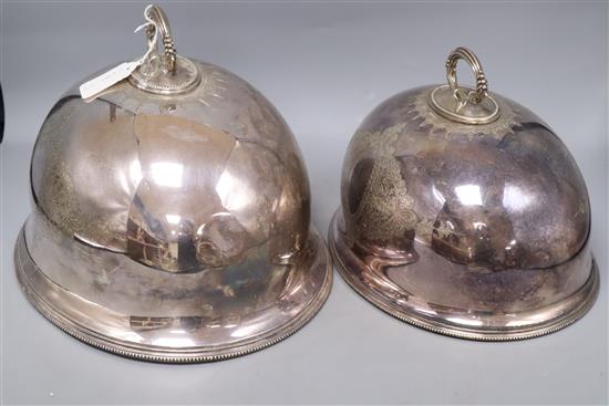 Two Victorian silver plated meat dish covers, largest 35 x 28cm